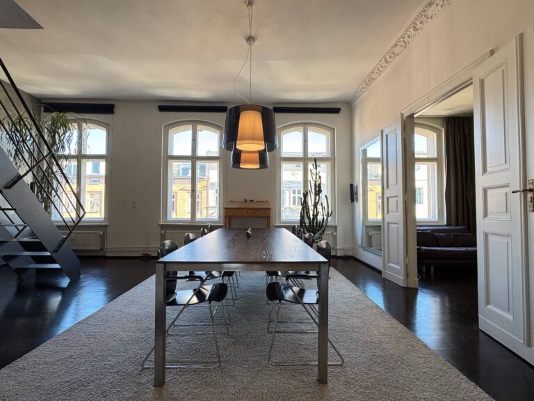 Loft-style open-plan living area with oak parquet floors, Bergmannkiez Berlin maisonette