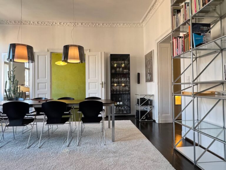 Modern steel staircase connecting both floors of the maisonette